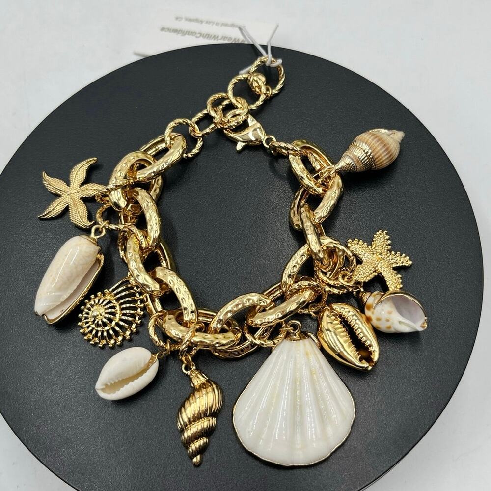 ETTIKA Mermaid‎ Tears
Sea Shell and 18k Gold Plated Charm Cha Cha Bracelet